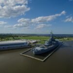 gray ship beside building